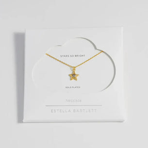 Blue star necklace on a white card with 'Estella Bartlett' branding.
