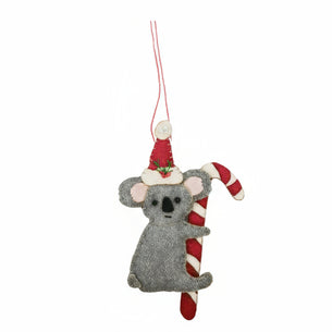 Decorative ornament of a koala with a Santa hat and candy cane on a white background