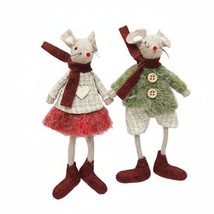 Two toy mice dressed in festive clothing holding hands on a white background