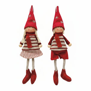 Two red and white knitted dolls with hats on a white background